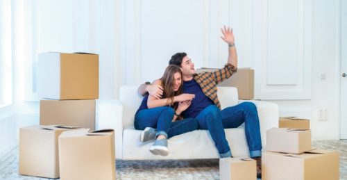 Couple enjoying new home after moving using a man with a van