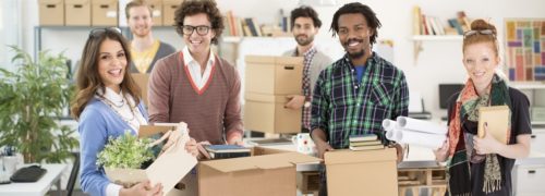 Employees packing for office removals