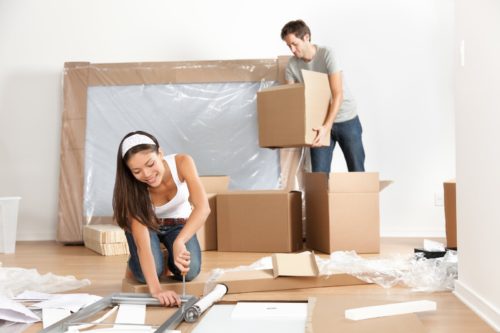 Couple moving to new home - packing for moving house