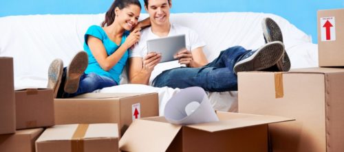 Couple looking for and comparing moving house quotes