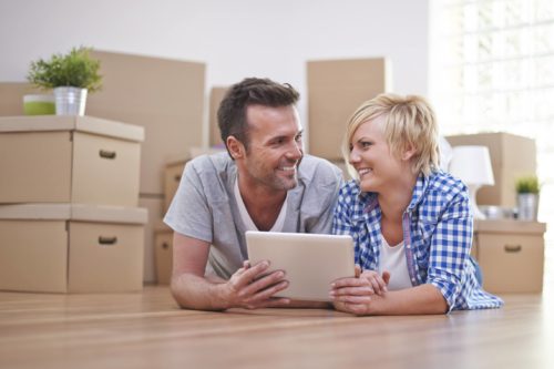 Couple comparing prices of moving companies