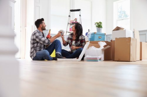 Couple celebrating moving to new house