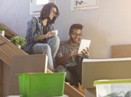 Young couple looking for online quotes for removals