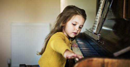 Girl playing the piano - piano removals